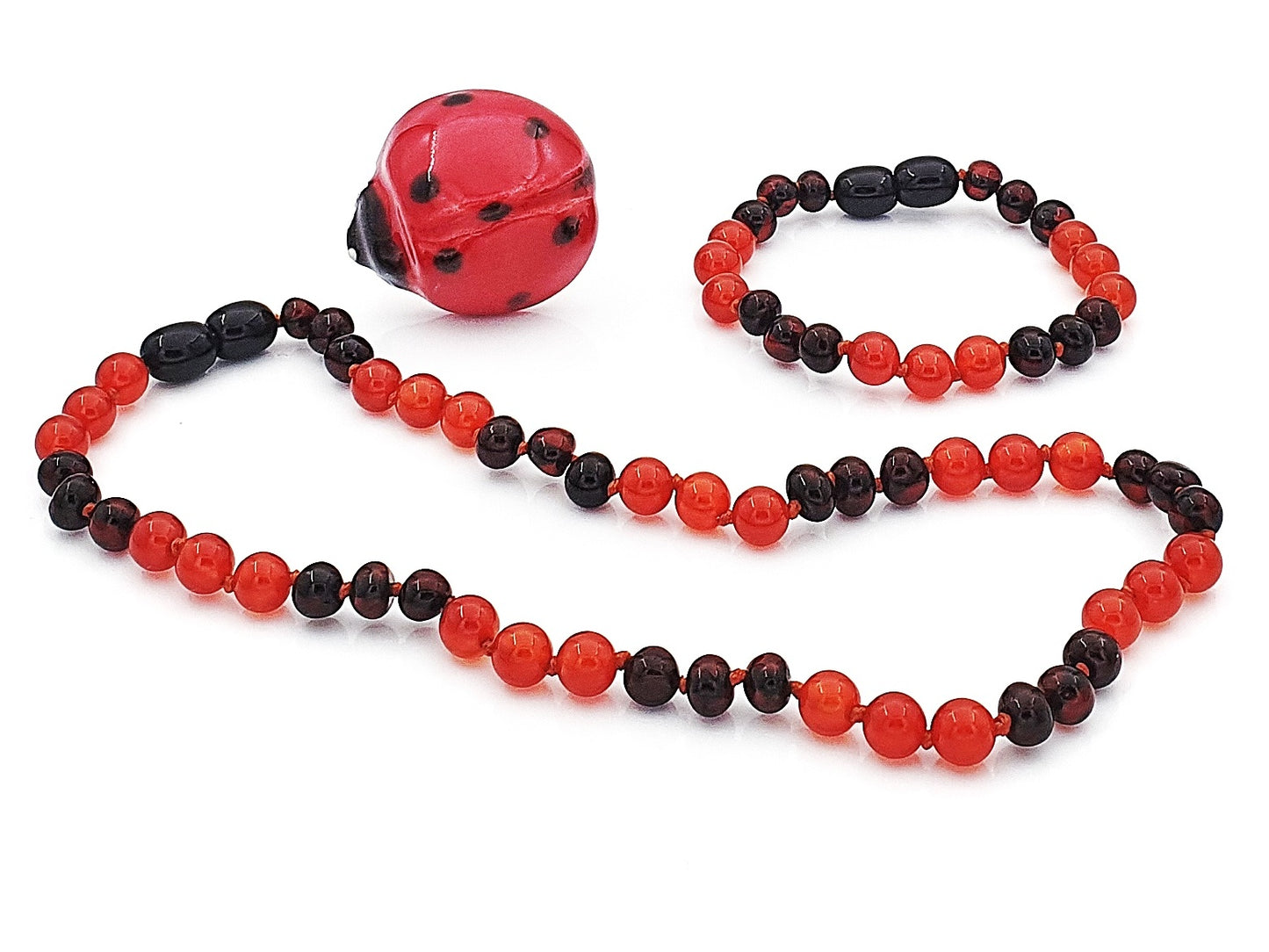 Red carnelian gemstones with Baltic amber jewelry