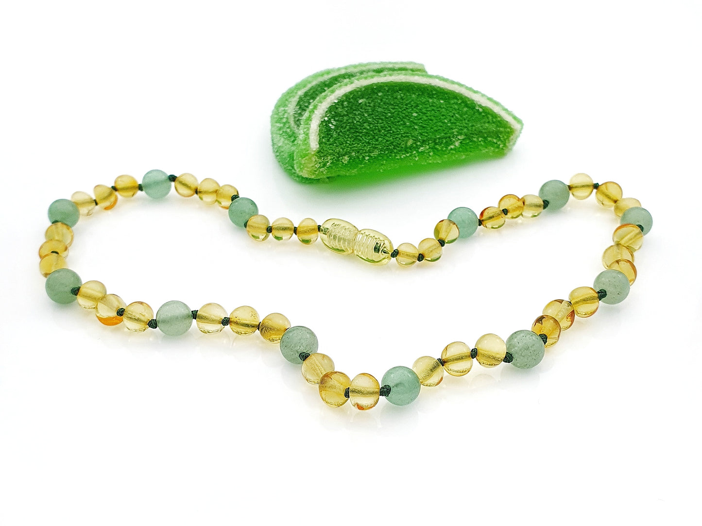 amber teething necklace with green stones