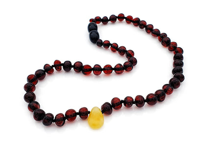 polished cherry amber teething necklace with natural pendant
