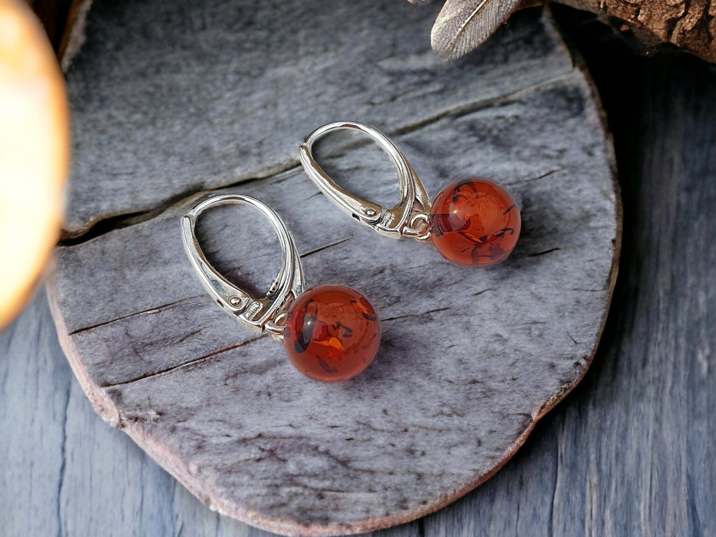 Dangle silver earrings round style with Baltic amber stone