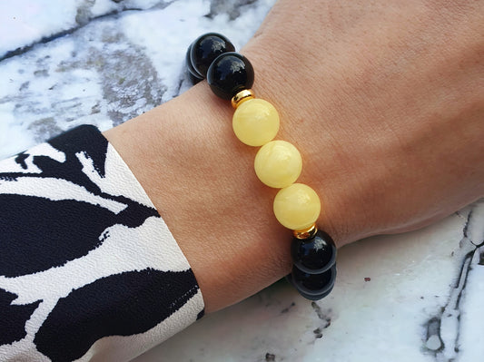 Onyx bracelet with natural white amber with gold silver