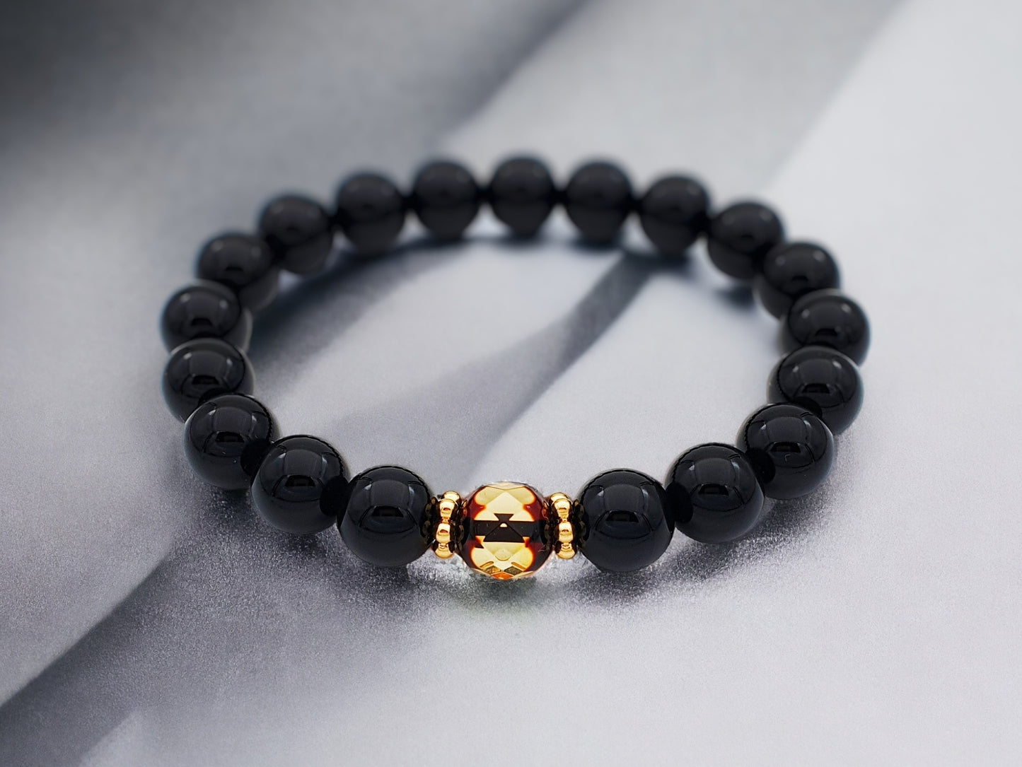 Natural onyx semi precious bracelet with faceted Baltic amber stone